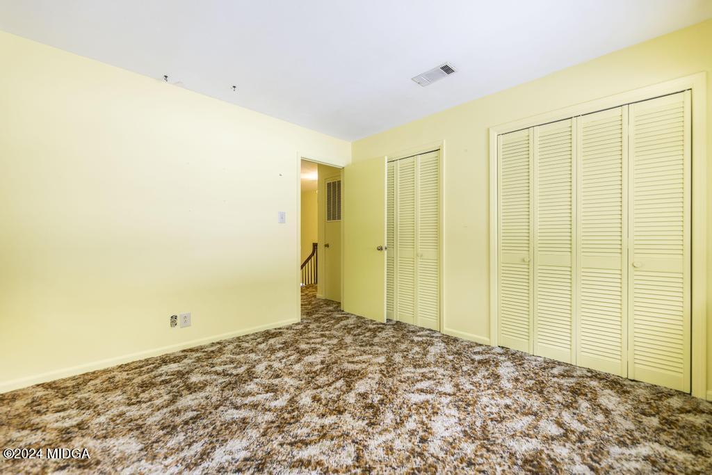6909 Forsyth Road Macon, GA 31210 - Photo 46 of 53 a view of a big room with a cabinet and a large window