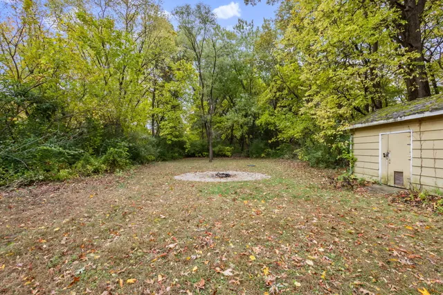 a view of backyard with green space