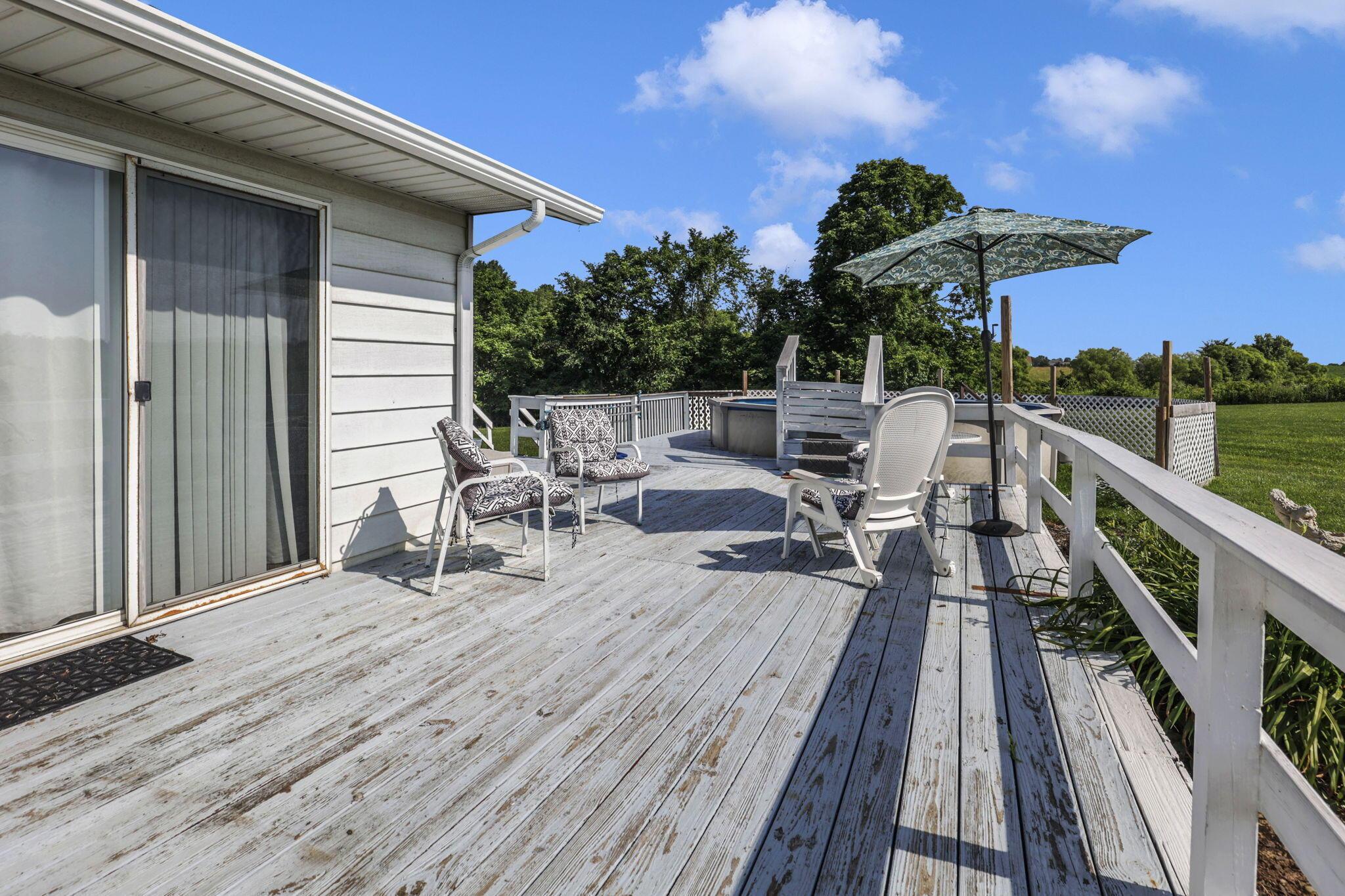 6605 Lancaster Road Hebron, OH 43025 - Photo 34 of 53 A large deck with a in ground pool and stunning views.