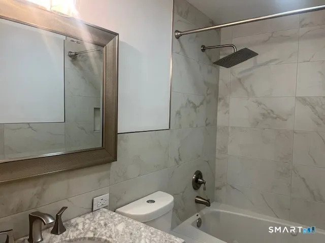 a bathroom with a sink and shower