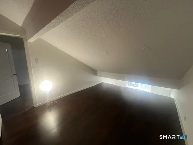 a view of room with an empty space and a window