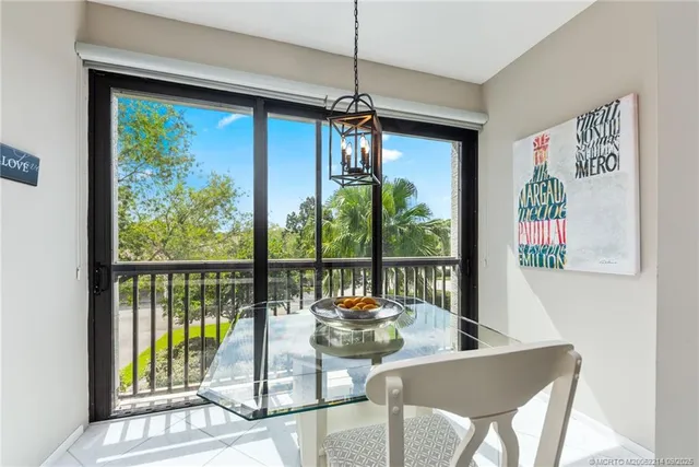 a view of a dining room with furniture window and outside view