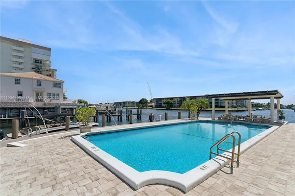 a view of a swimming pool with a lounge chair