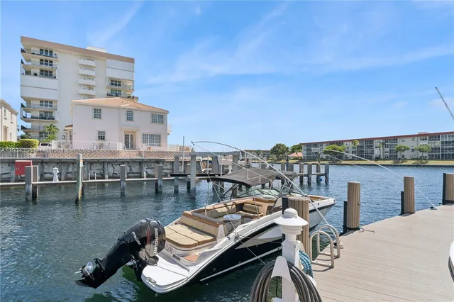 a view of a roof deck with furniture
