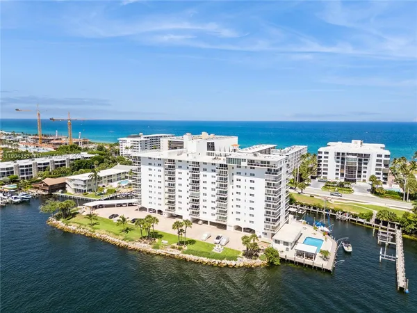 an aerial view of a house with a ocean view