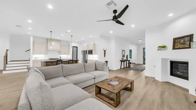 a kitchen with kitchen island a counter top space appliances and cabinets