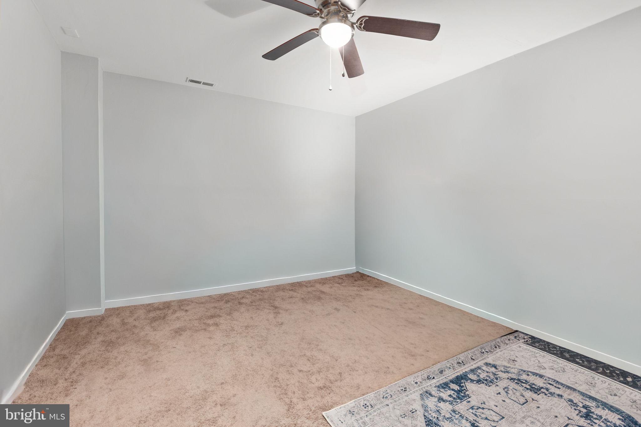 22088 Landora Bridge Road Ruther Glen, VA 22546 - Photo 92 of 122 Spacious room with soft, neutral tones.