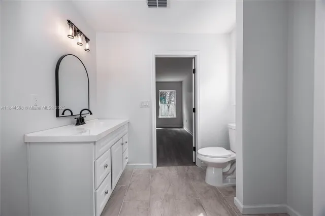 a bathroom with a sink and a toilet