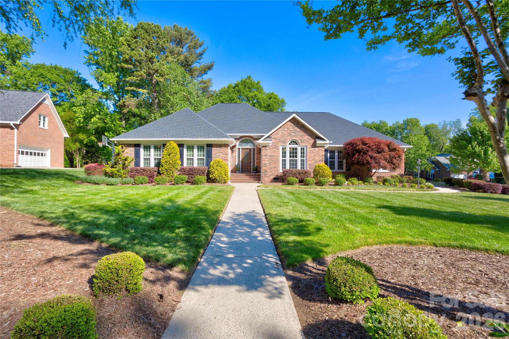 1188 Fawn Ridge Road Northwest Concord, NC 28027 - Photo 2 of 38 a front view of a house with garden