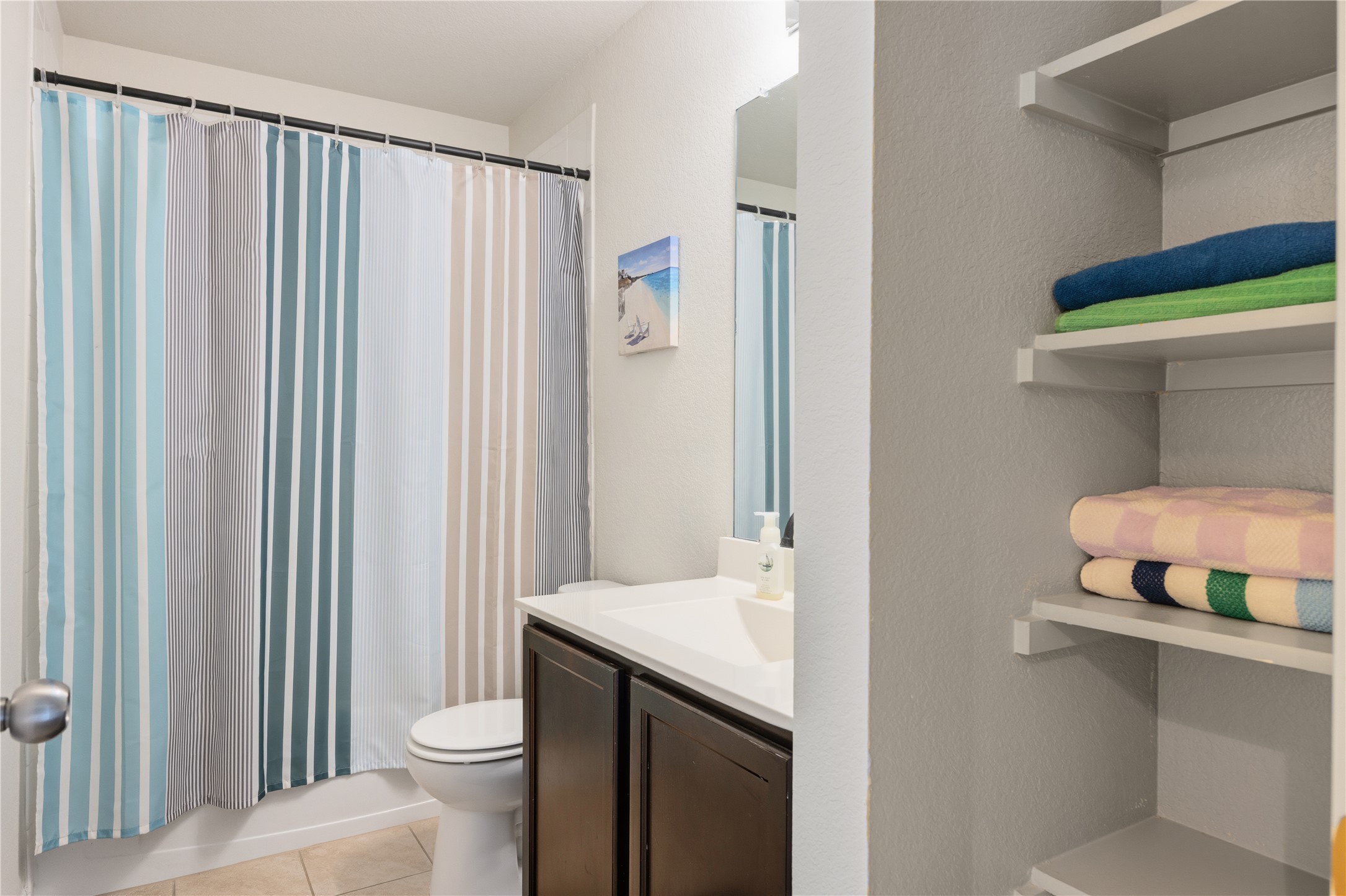 509 Pinnacle Drive Georgetown, TX 78626 - Photo 12 of 25 a bathroom with a sink a toilet and shower curtain