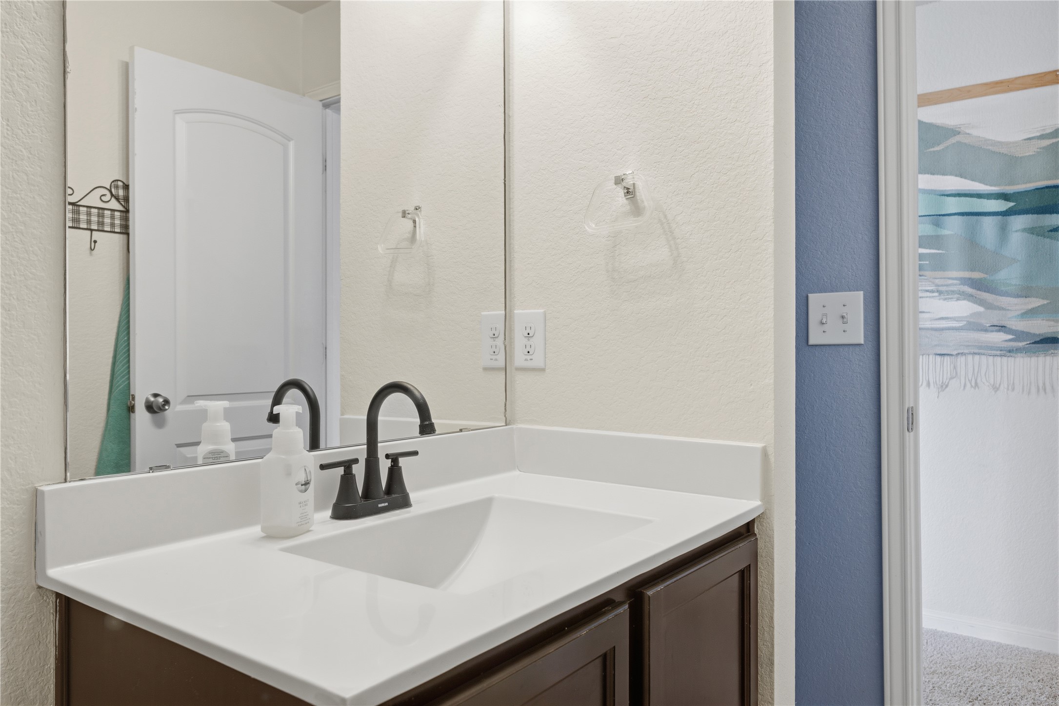 509 Pinnacle Drive Georgetown, TX 78626 - Photo 13 of 25 a bathroom with a sink and a mirror