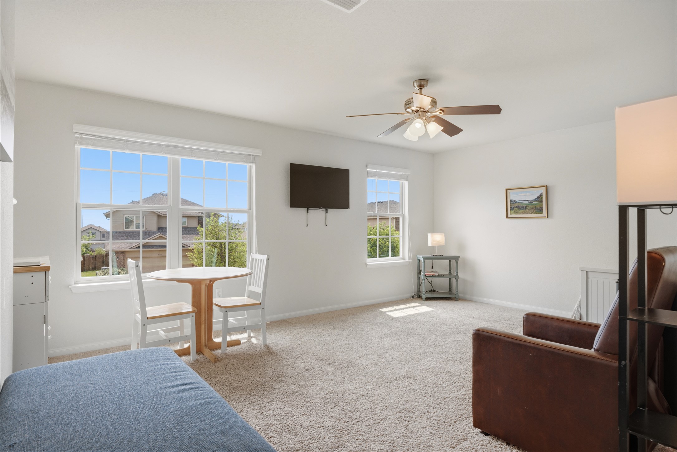 509 Pinnacle Drive Georgetown, TX 78626 - Photo 19 of 25 a living room with furniture a ceiling fan and a window