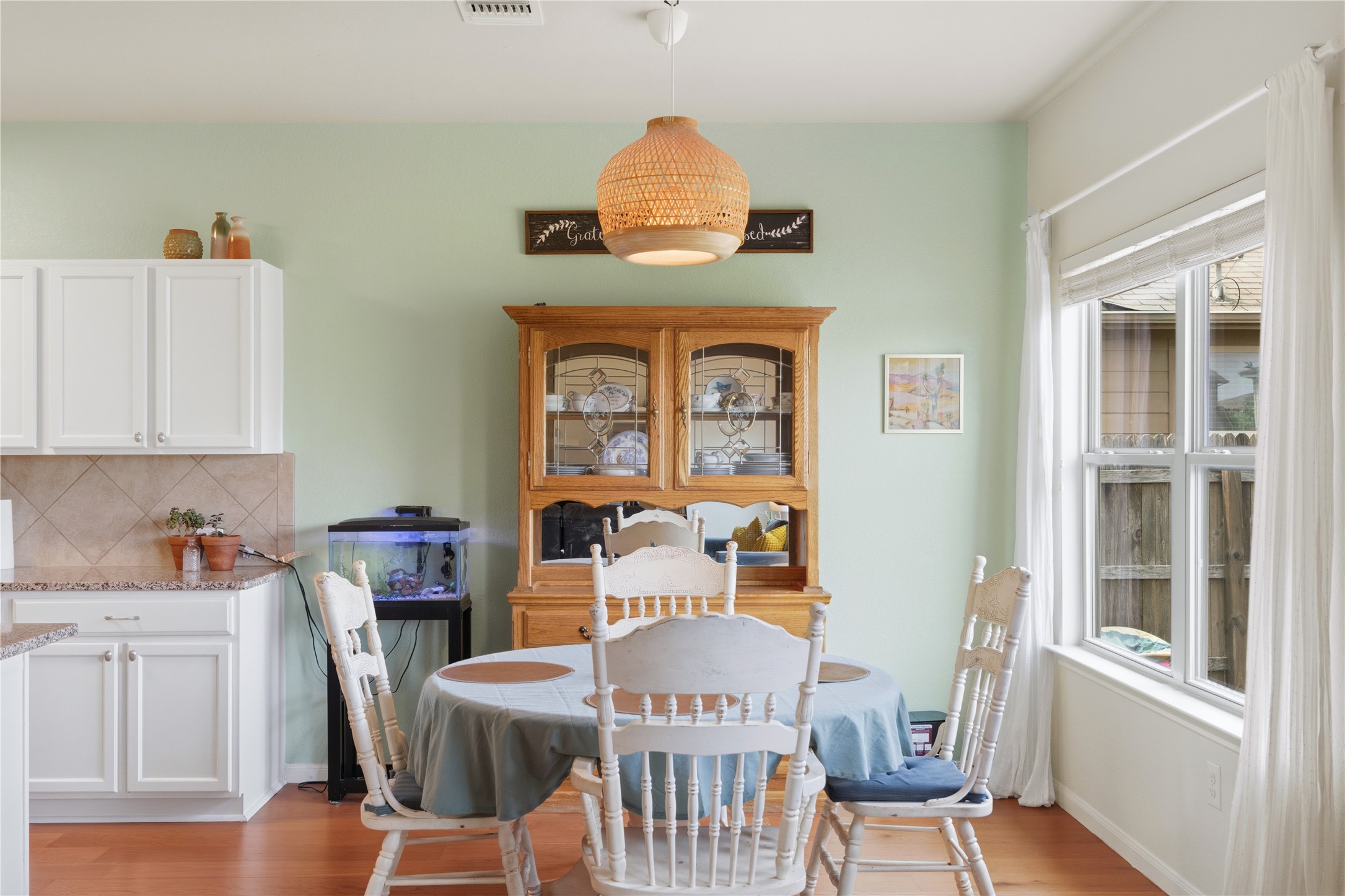 509 Pinnacle Drive Georgetown, TX 78626 - Photo 21 of 25 a view of a dining room with furniture window and wooden floor
