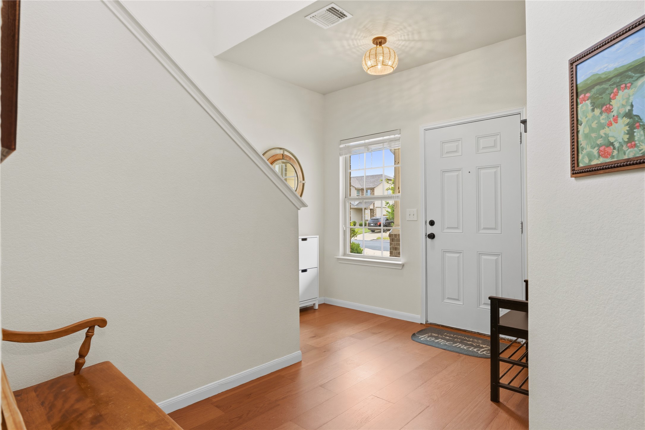509 Pinnacle Drive Georgetown, TX 78626 - Photo 3 of 25 a view of an empty room with window and wooden floor