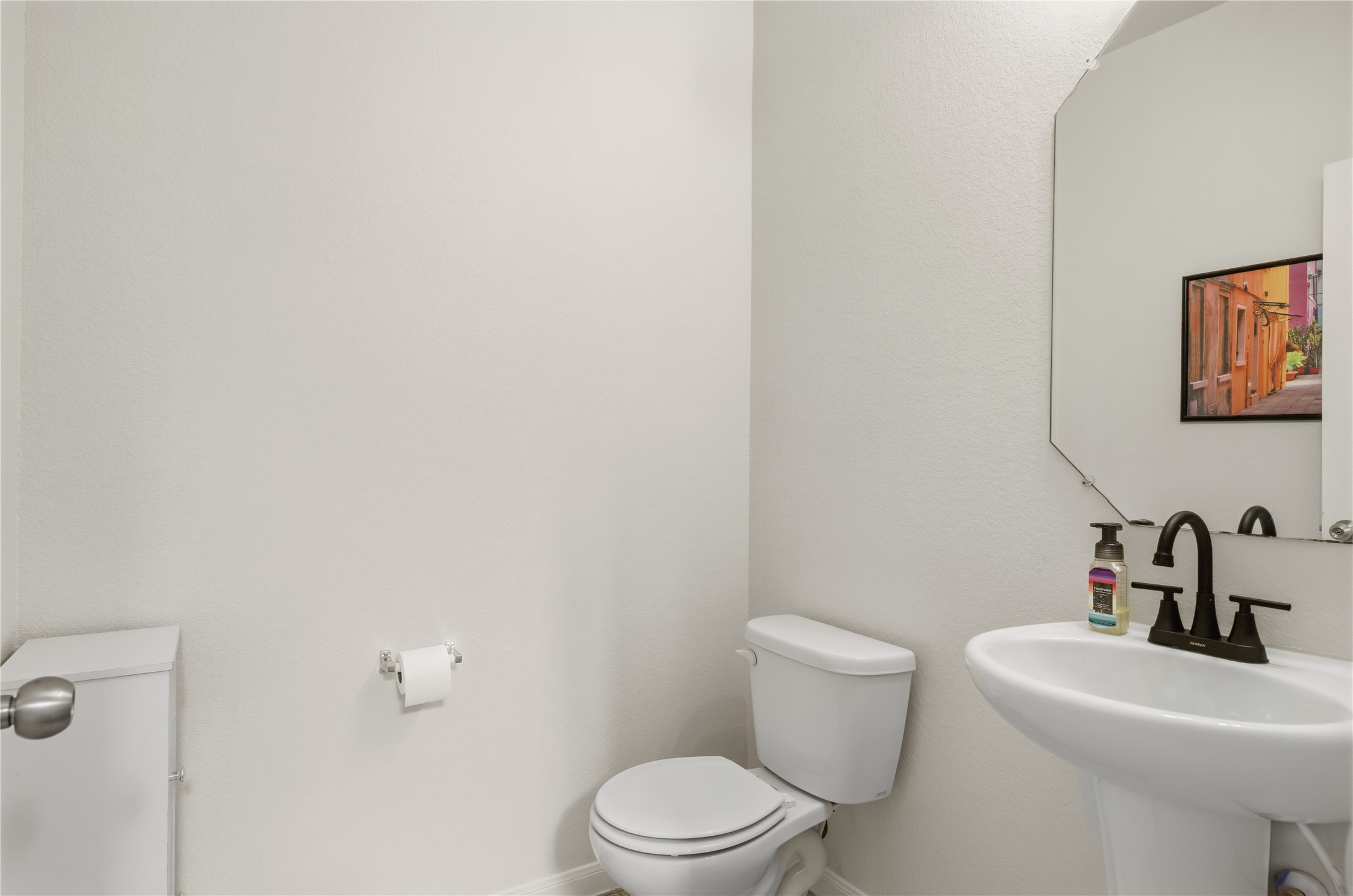509 Pinnacle Drive Georgetown, TX 78626 - Photo 6 of 25 a bathroom with a toilet a sink and mirror