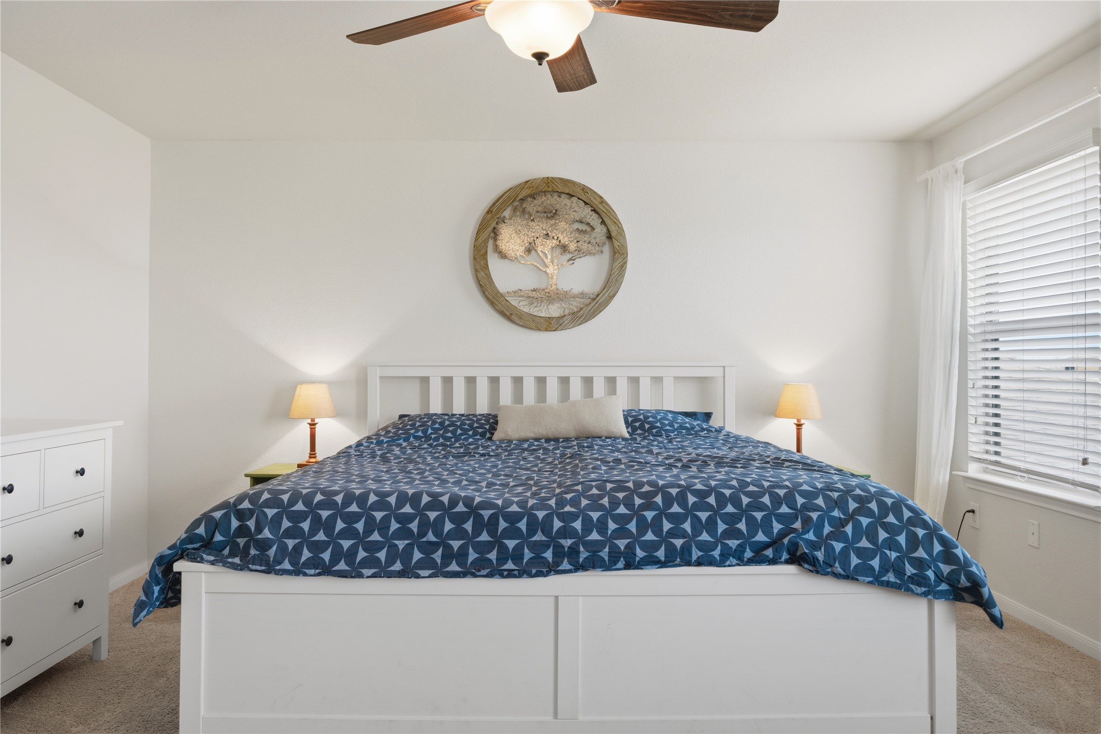 509 Pinnacle Drive Georgetown, TX 78626 - Photo 8 of 25 a bedroom with a large bed and a chandelier