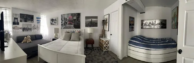 a view of a dining room with furniture one side kitchen view and a window