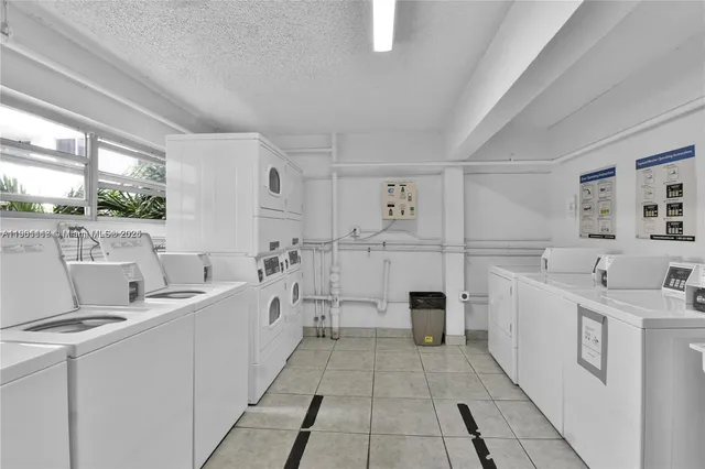 a view of a swimming pool with outdoor seating