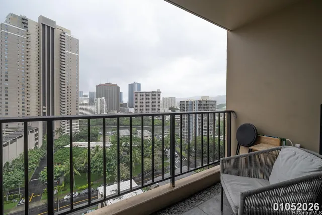 a view of a balcony with wooden floor