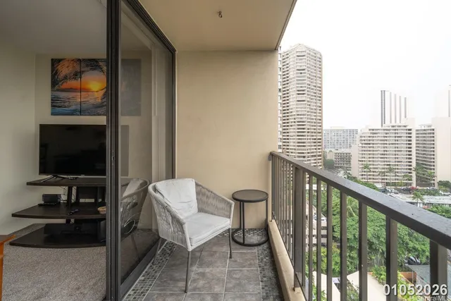 a view of a balcony and a dining table