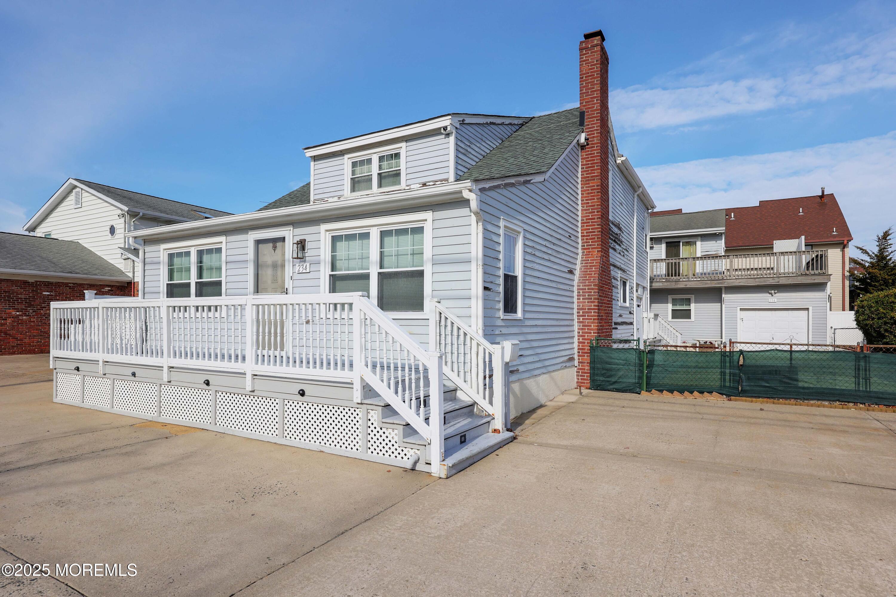 234 Hancock Avenue Seaside Heights, NJ 08751 - Photo 4 of 38 a view of a house with a small yard