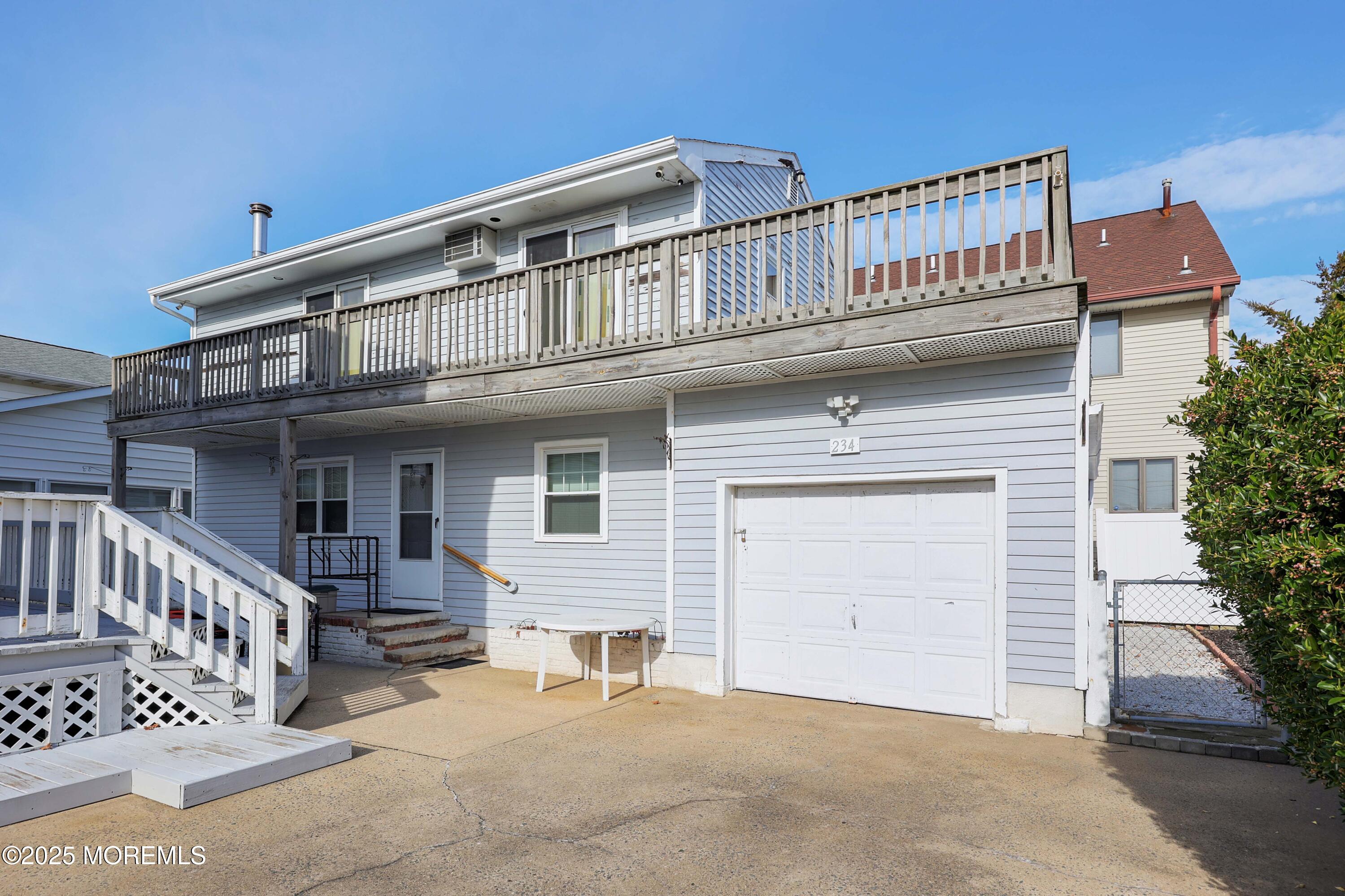 234 Hancock Avenue Seaside Heights, NJ 08751 - Photo 9 of 38 a front view of a house with garage