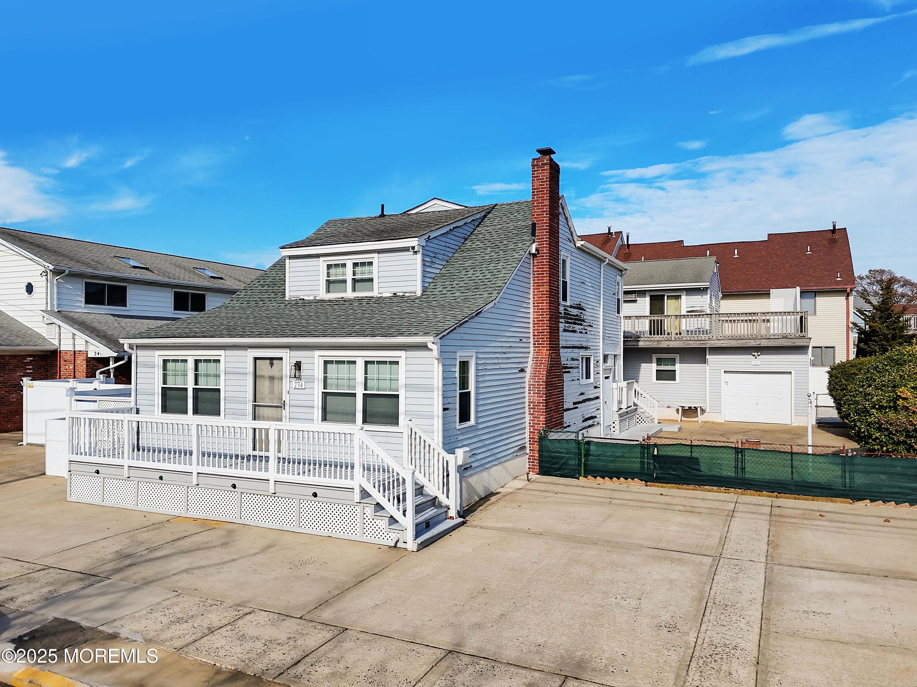 234 Hancock Avenue Seaside Heights, NJ 08751 - Photo 10 of 38 a front view of a house with a garden and plants