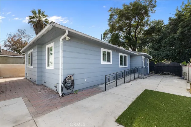 a view of a house with a yard and a garage