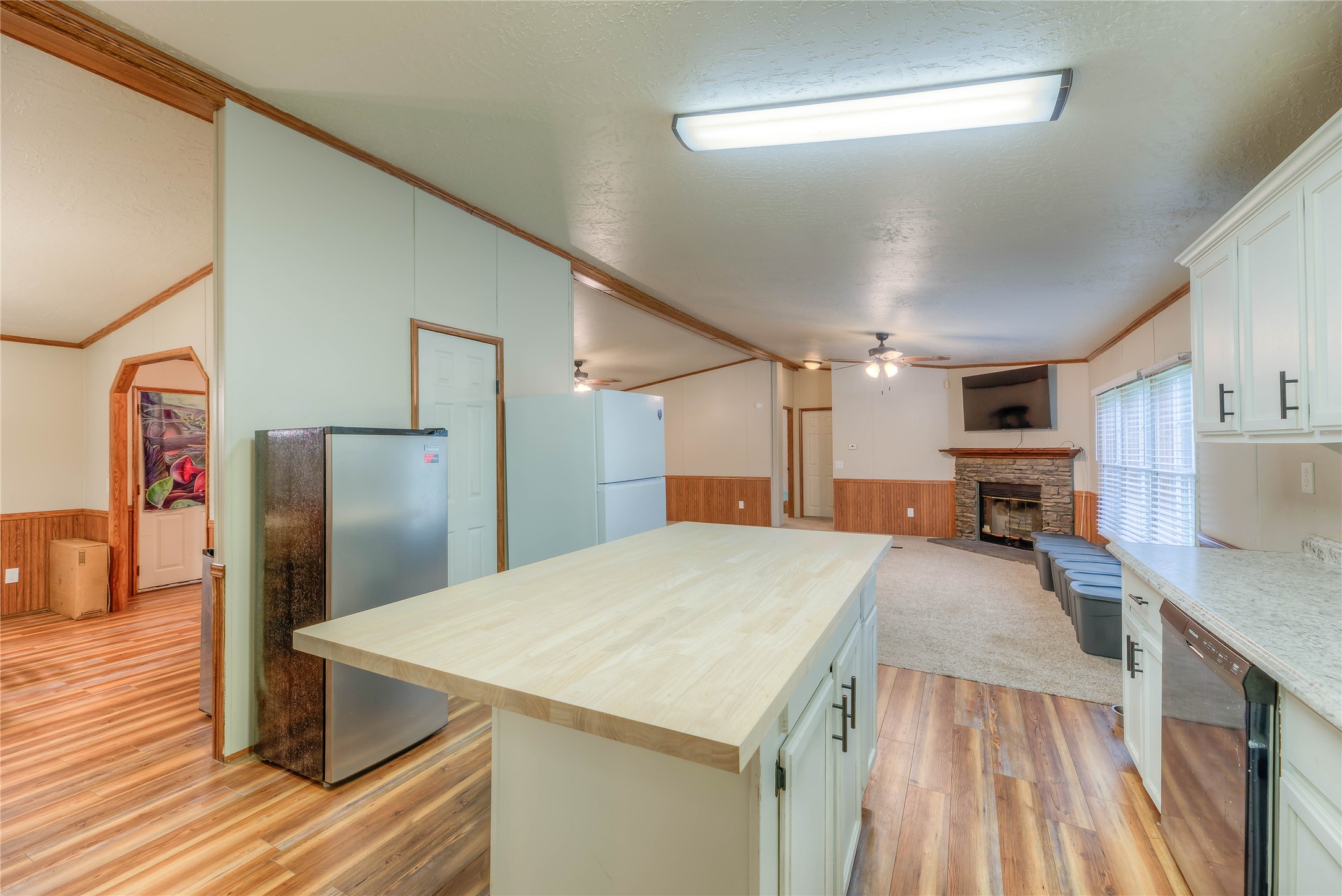 657 Parrish Road Livingston, TX 77351 - Photo 14 of 47 a kitchen with a refrigerator and a sink