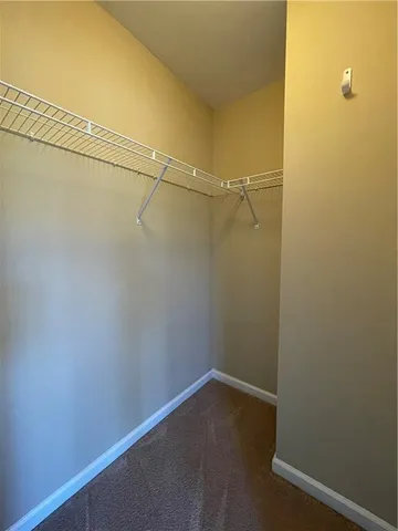 a bathroom with a toilet a sink a vanity and mirror