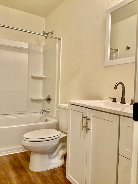 2002 West 2nd Street, Unit 802 Taylor, TX 76574 - Photo 7 of 13 a bathroom with a toilet sink and shower