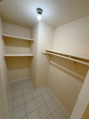 a view of storage and utility room with empty racks