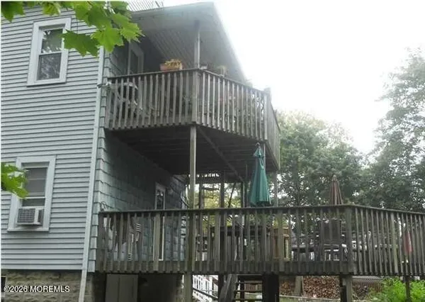 a view of balcony with small yard