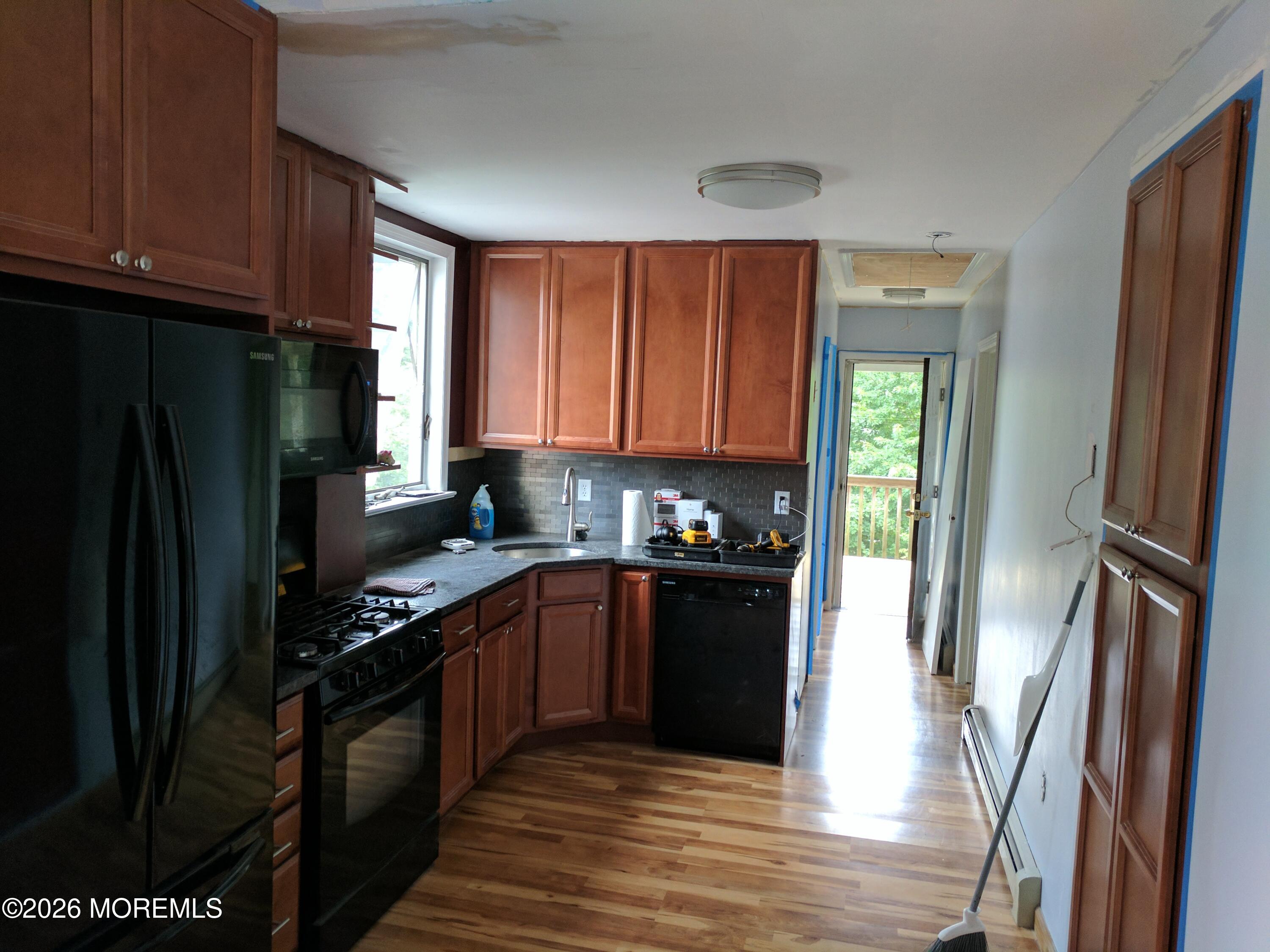 190 Jackson Street Matawan, NJ 07747 - Photo 7 of 24 a kitchen with stainless steel appliances granite countertop a refrigerator stove and sink