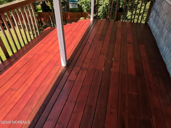 a balcony view with hardwood floor