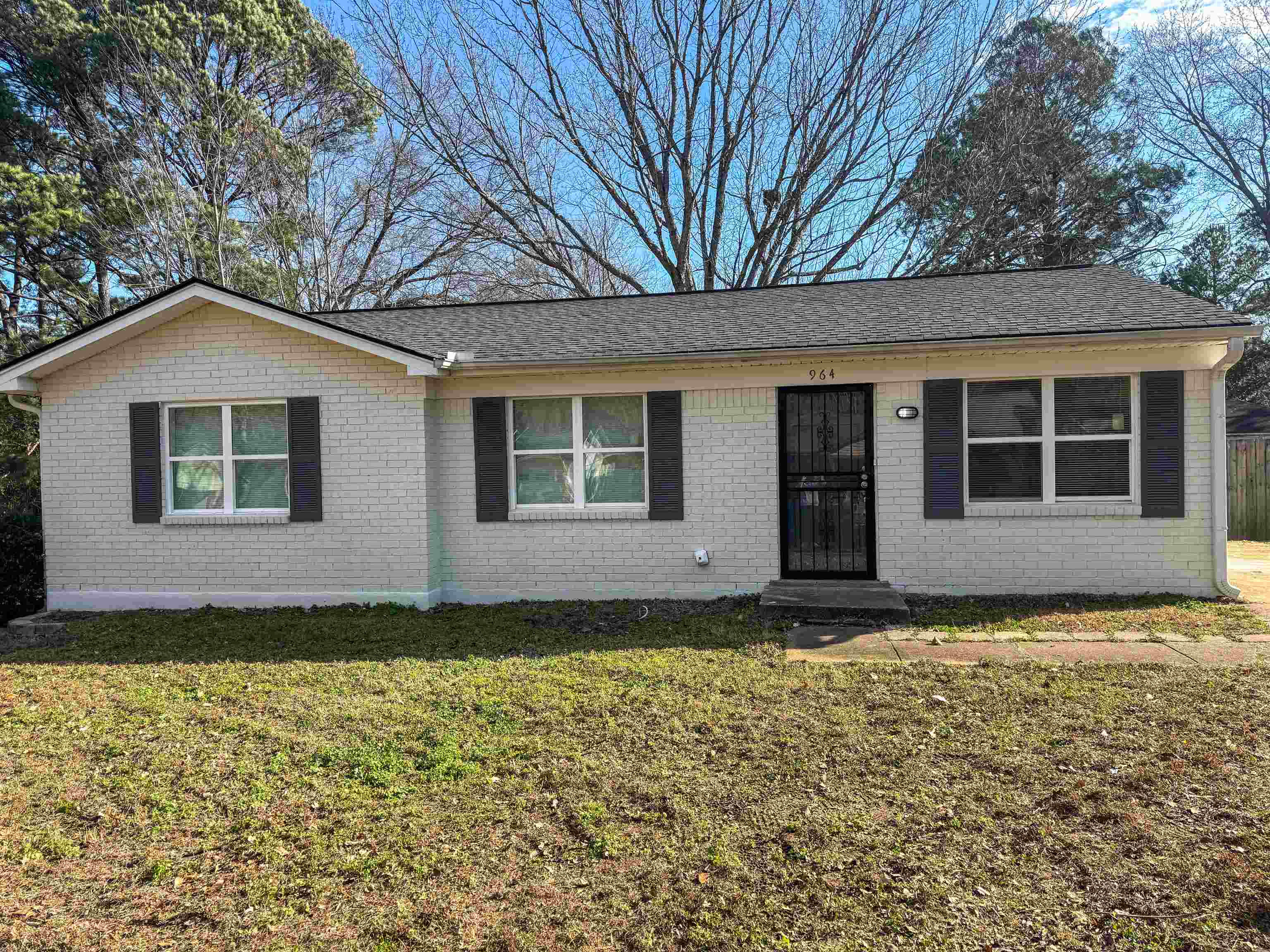 964 Greencliff Road Collierville, TN 38017 - Photo 1 of 7 Ranch-style home featuring a front lawn, brick siding, and a shingled roof