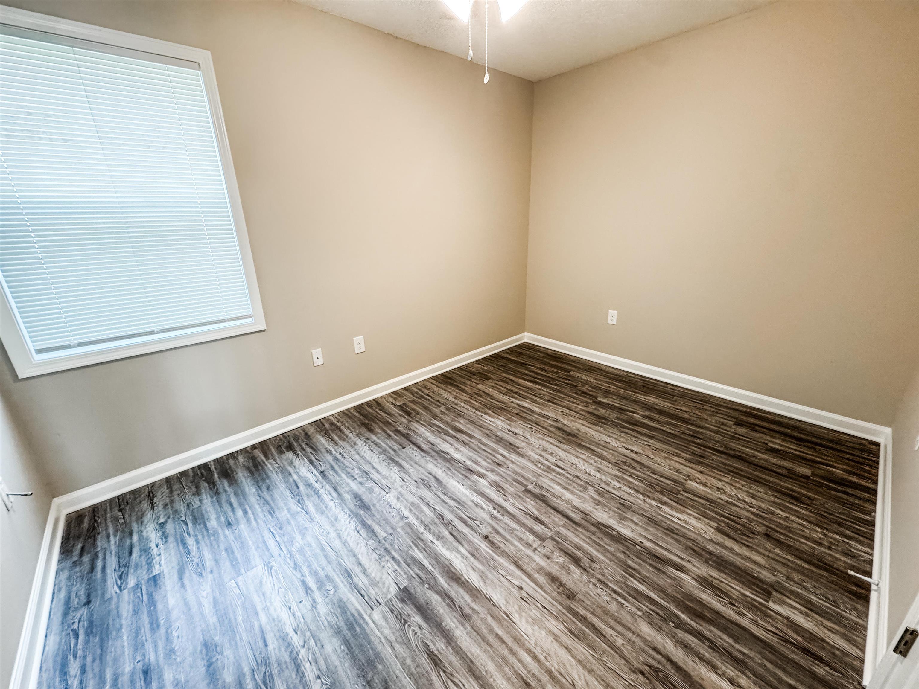 964 Greencliff Road Collierville, TN 38017 - Photo 7 of 7 Empty room with wood finished floors and baseboards