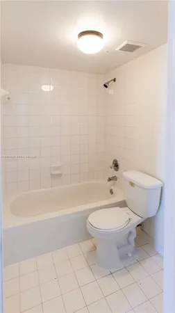 a bathroom with a toilet a sink and bathtub