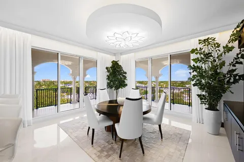 a spacious bedroom with a large bed and a large window