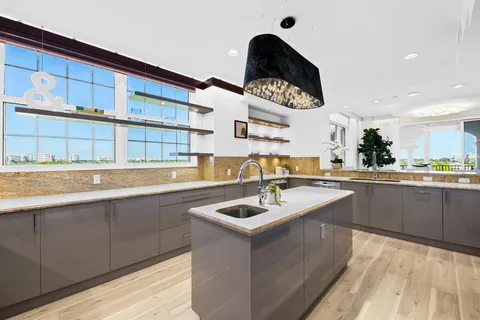 a view of a dining room with furniture and a window