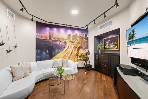 a bathroom with a bathtub shower sink and toilet