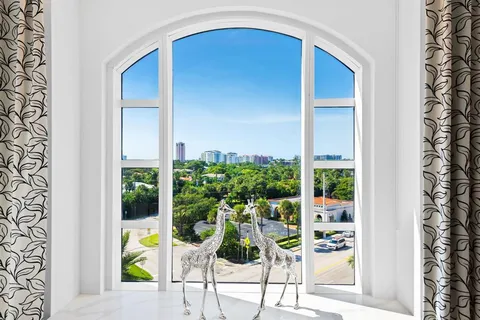 a view of a city with an ocean and a mountain view