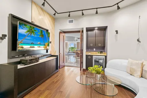 a bathroom with a glass shower door and a mirror
