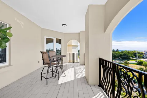 a hallway with a sink and a refrigerator