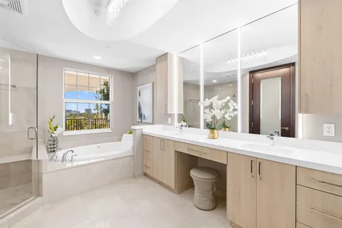 a bathroom with a sink mirror and vanity