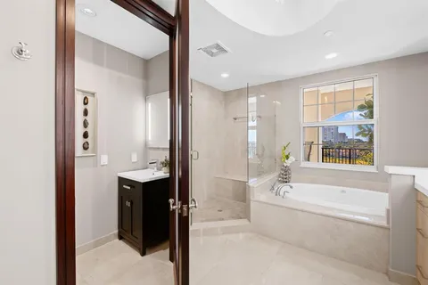 a dining room with furniture a chandelier and window