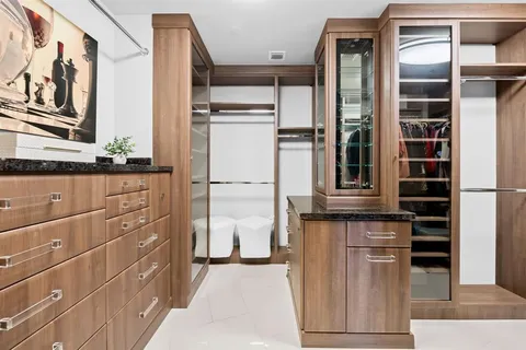 a living room with furniture and a glass door