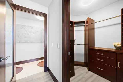 a living room with furniture a rug and a flat screen tv