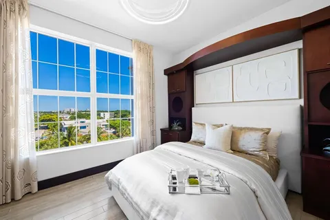 a view of a living room and kitchen with furniture