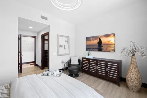 a front view of a residential apartment building with a yard